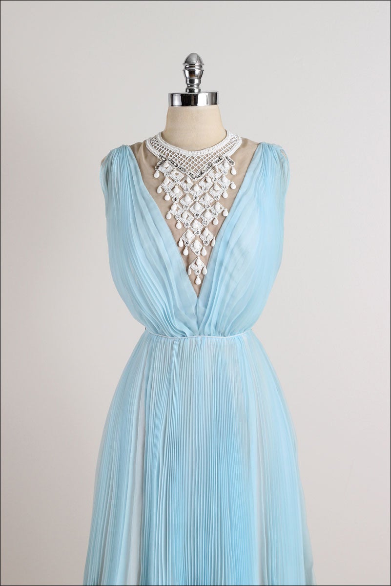 ➳ vintage 1960s dress

* powder blue crepe chiffon
* nude acetate lining
* white bead & rhinestone jeweled bib 
* pleated skirt & bodice
* by Jack Bryan

condition | excellent

fits like xs/s

length 39