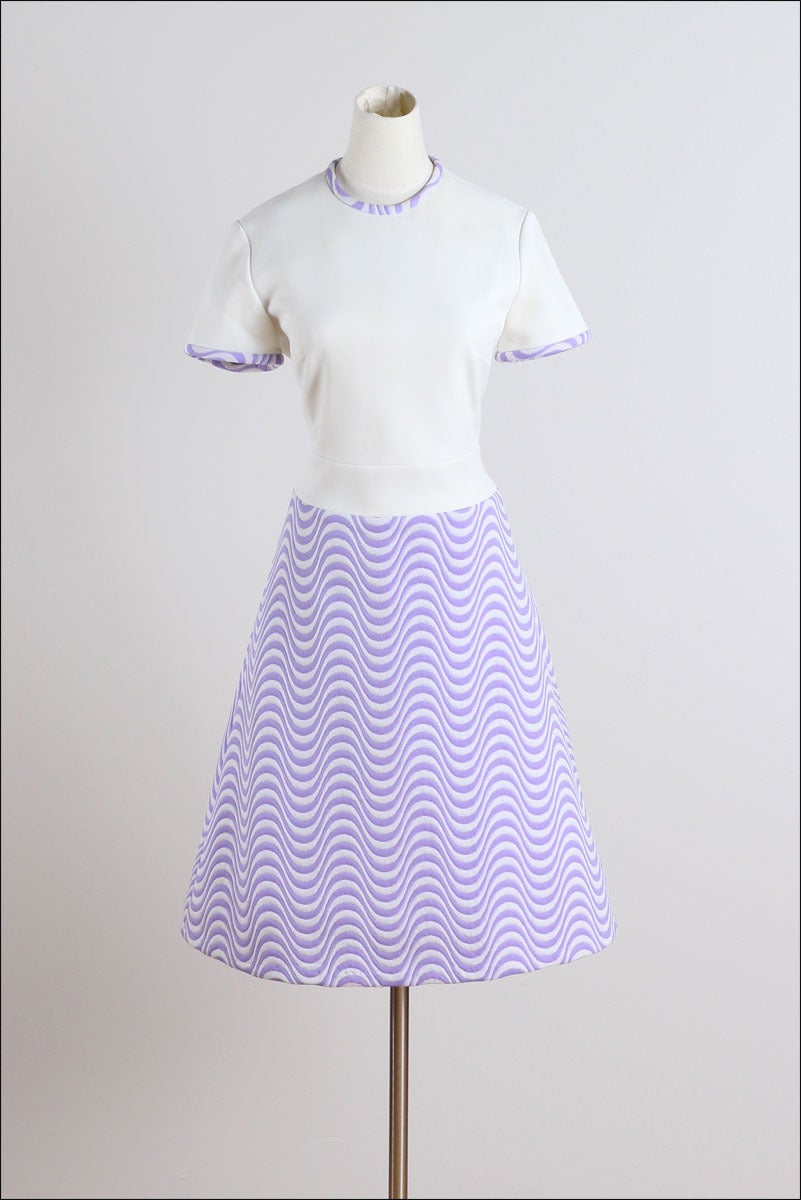 ➳ vintage 1960s dress and coat

* cream/purple optical stripe heavy polyester knit
* acetate lining
* detachable tie belt/ button front on coat
* back zipper on dress
* by Lilli Ann

condition | excellent

fits like m/l

dress:
length