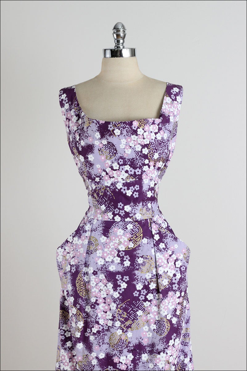 ➳ vintage 1950s dress

* purple cotton/ cotton lining
* white and gold asian floral print
* tie back
* side pockets
* metal back zipper
* by Shaheen

condition | excellent

fits like xs/s

length 42