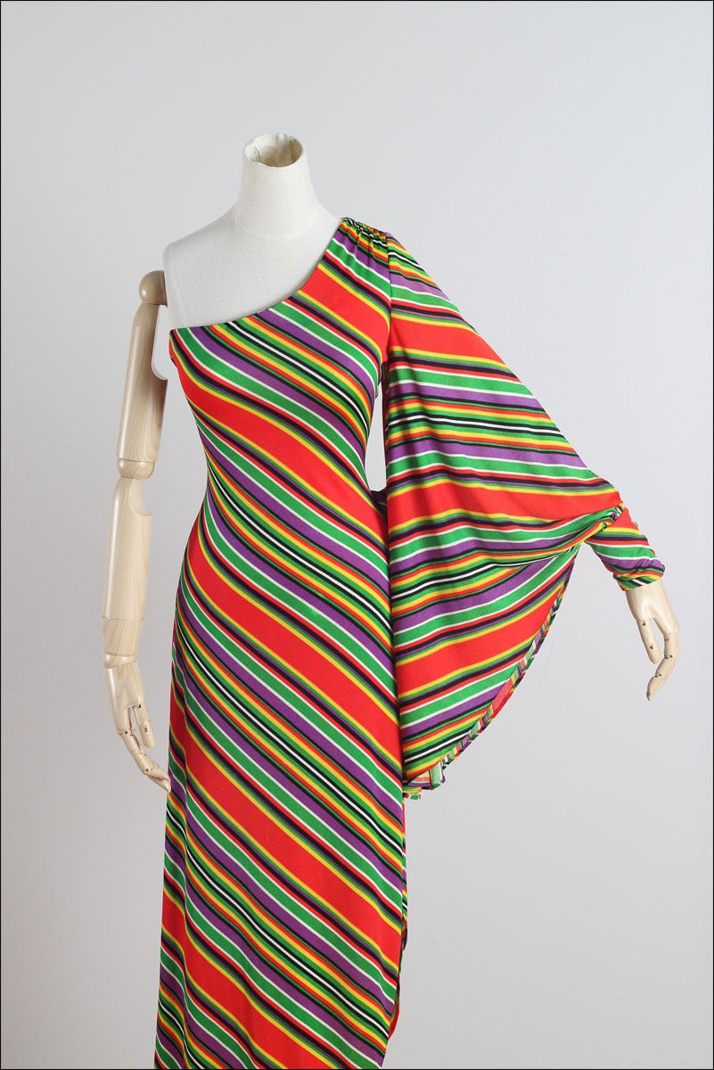 ➳ vintage 1970s dress

* colorful striped jersey
* one shoulder
* open sleeve attached at waist 
* button cuff
* sexy high cut leg
* back zipper
* by Funky

condition | excellent 

fits like xs/s/m

dress length 58