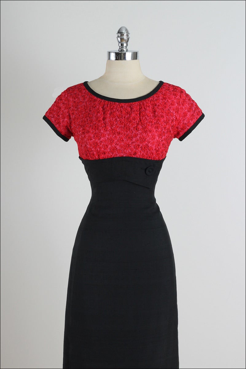 ➳ vintage 1960s dress

* red & black silk dupioni
* silk lining
* red floral embroidery on bodice
* front button accent
* back zipper

condition | excellent

fits like xs/s

length 41