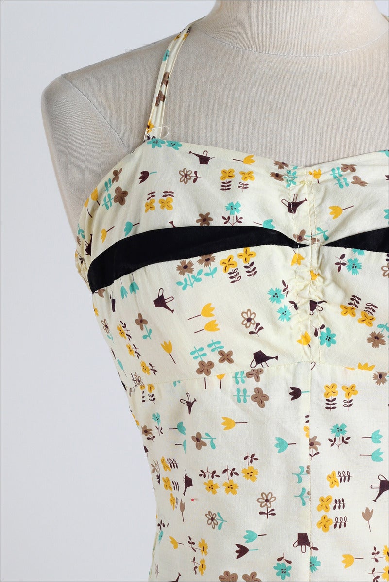 ➳ vintage 1950s swimsuit

* yellow watering can print cotton
* bodice stays
* elastic back bodice
* tie halter straps
* pockets
* by Lee Swimplay Suits

condition | excellent 

fits like large

dress length 25