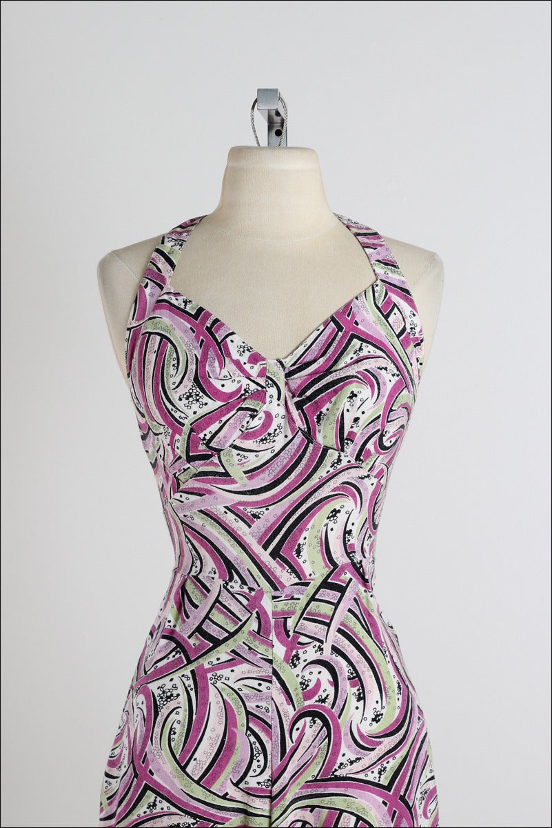 ➳ vintage 1950s swimsuit

* purple & green striped cotton
* button halter straps
* metal back zipper

condition | excellent 

fits like medium

dress length 24