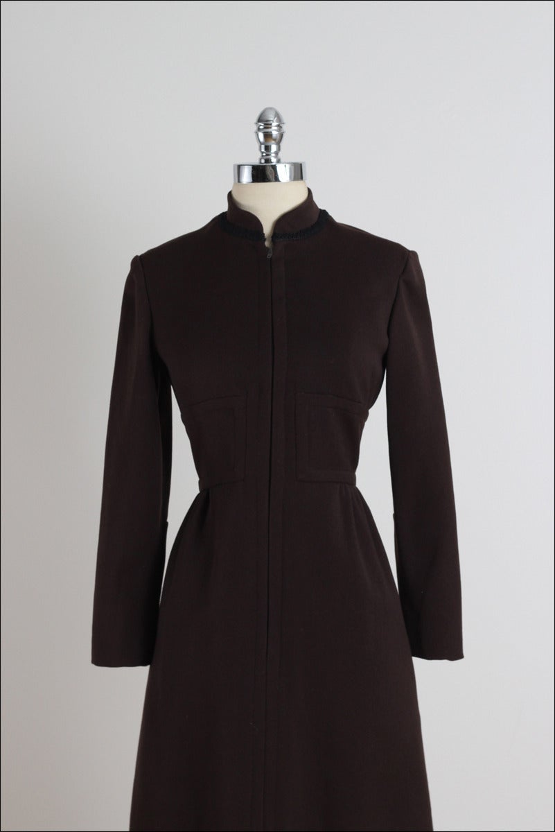 ➳ vintage 1960s dress

* chocolate brown wool
* acetate lining
* black rope trim accents
* skirt pockets
* front zipper
* by Ceil Chapman

condition | excellent

fits like m/l

length 41