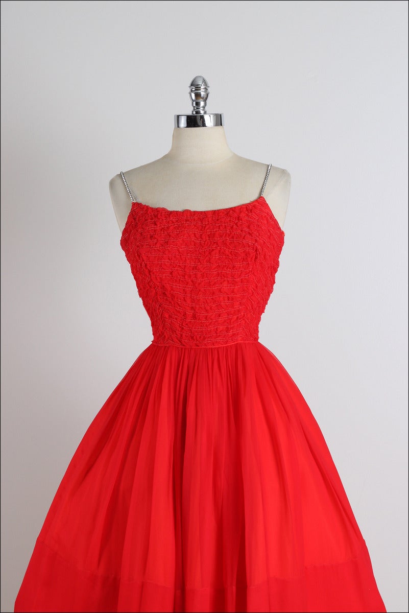 ➳ vintage 1950s dress

* red crepe chiffon
* acetate lining
* rhinestone spaghetti straps
* gathered bodice
* metal back zipper

condition | excellent

fits like xs/s

length 37