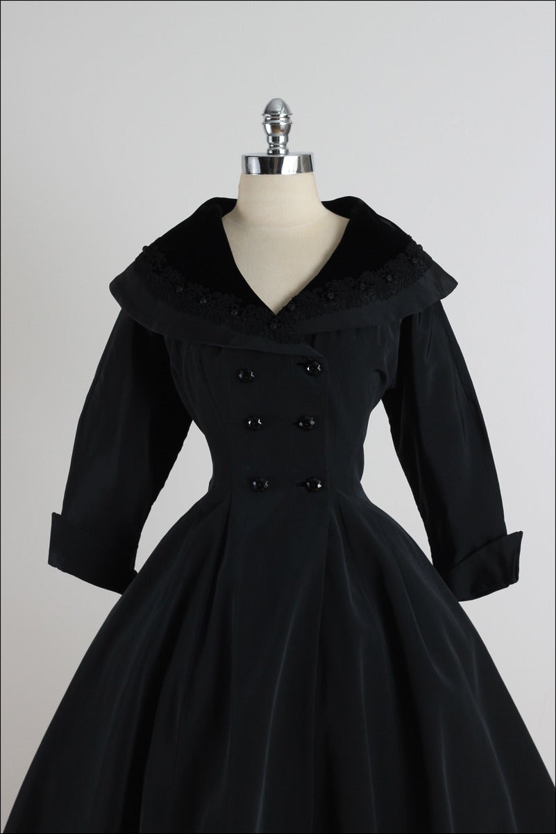 ➳ vintage 1950s coat

* black rayon faille
* velvet collar
* rope embroidered collar
* pockets
* full skirt
* fit and flare style
* black button front

condition | excellent

fits like s/m

length 42