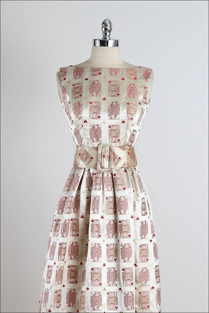 ➳ vintage 1960's dress

* champane silk brocade
* acetate lining
* red king & queen playing card novelty print
* detachable belt
* back zipper
* by Jon Mandl

condition | excellent

fits like xs

length 53