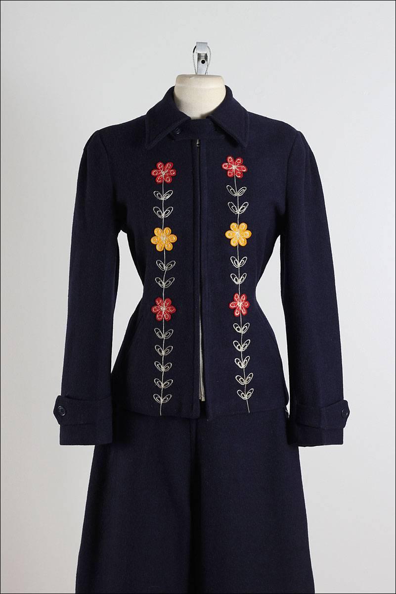 ➳ vintage 1940s ski suit

* navy wool
* flannel lining
* red & yellow floral embroidery
* pockets
* metal front zip jacket
* side button pants

condition | excellent - rare find in almost perfect condition

fits like medium

jacket