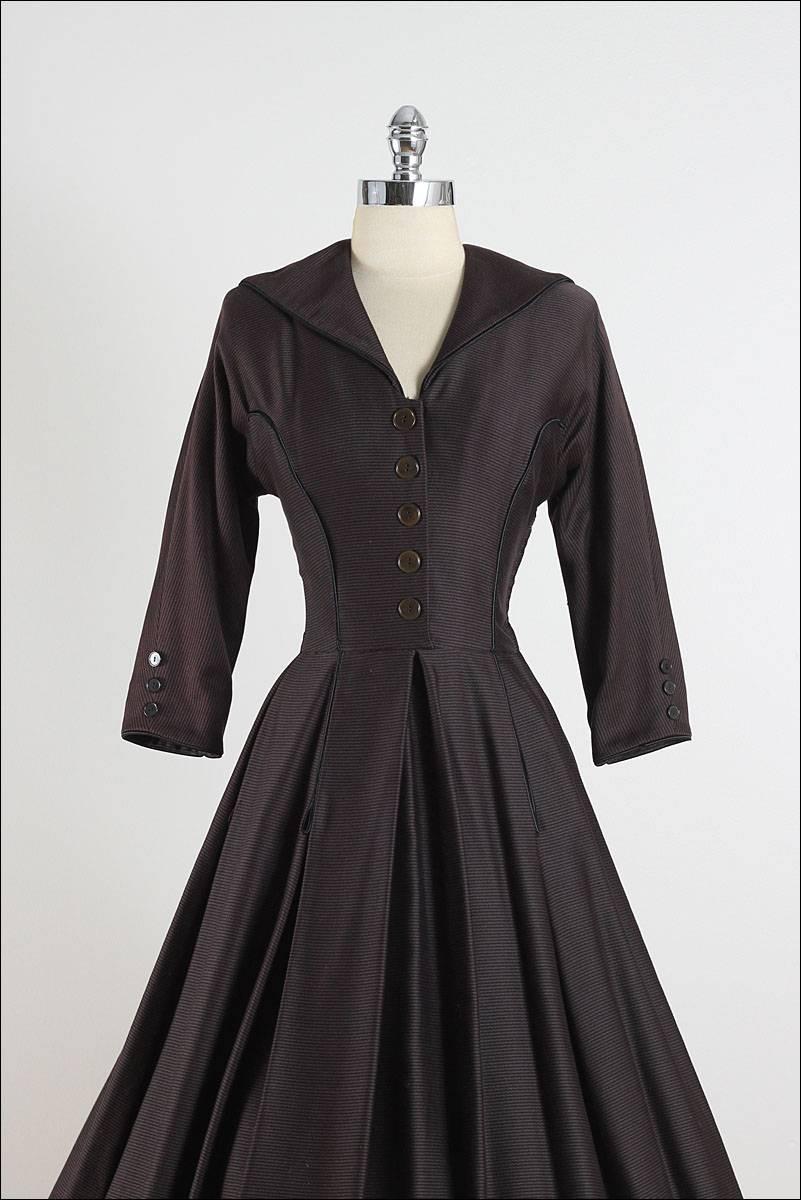 ➳ vintage 1950s dress

* black & brown striped wool blend, backed
* detachable belt
* brown button bodice
* metal side zipper
* perfect example of the 1950s 