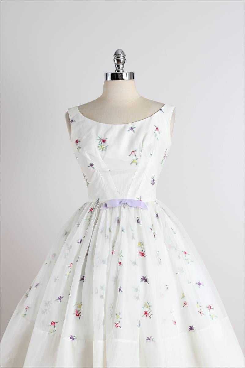 ➳ vintage 1950s dress

* white chiffon
* acetate lining
* beautiful floral embroidery
* purple bow accent
* metal back zipper
* by Fred Perlberg

condition | excellent

fits like xs/s

dress length 40