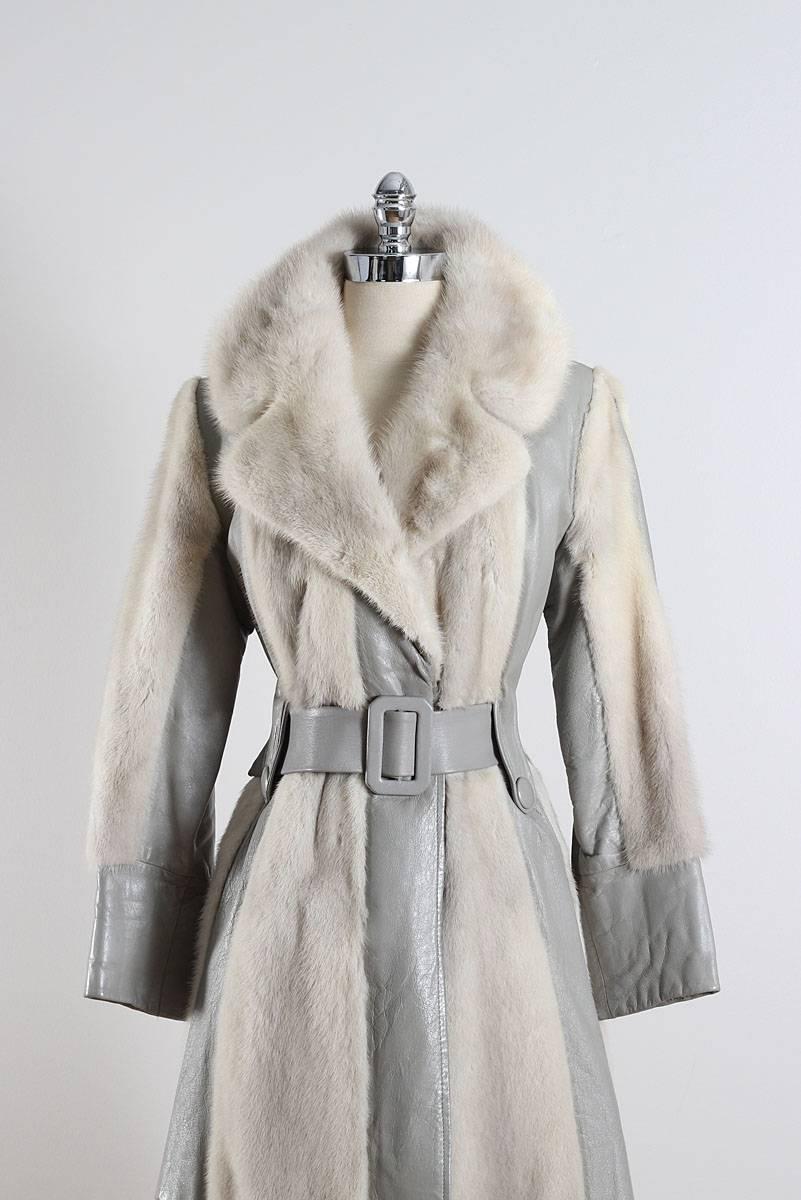 ➳ vintage 1970s coat

* dove gray leather
* silver mink fur trim
* acetate lining
* detachable belt
* velvet lined pockets
* front hook
* by Fur by Francis

condition | excellent 

fits like m/l

length 37