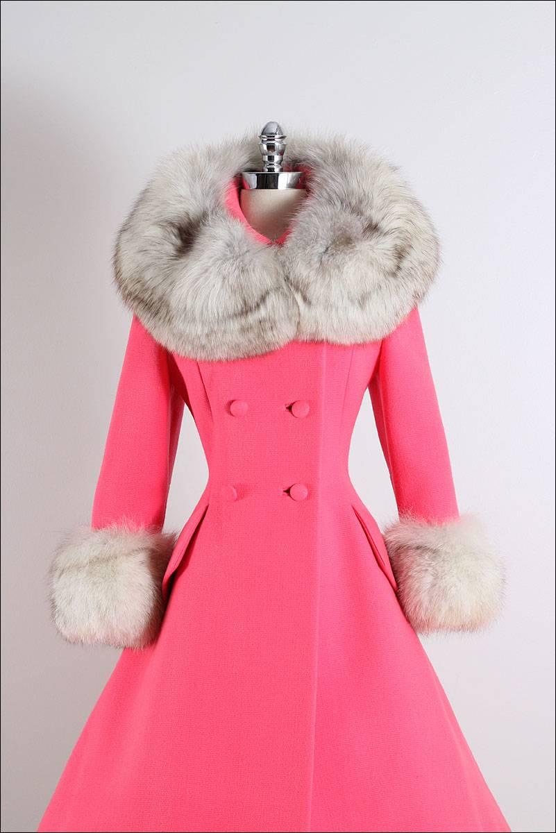 Vintage 1960's Coat

* pepto pink flat heavy wool
* silver fox fur trim
* gorgeous full skirt princess shape
* button front closure
* besom pockets
* acetate lining
* by Lilli Ann

fits like medium

length 42