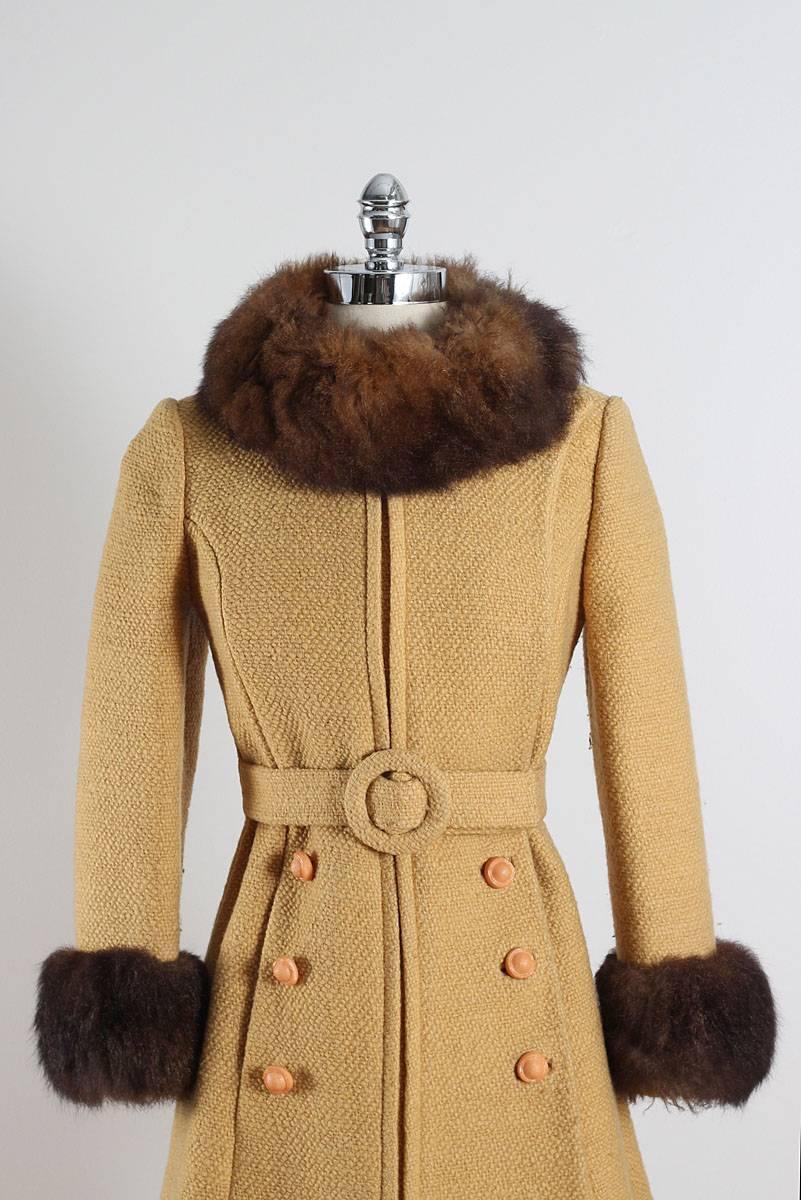 ➳ vintage 1960s coat

* butterscotch wool
* brown faux fur
* silk crepe lining
* button front with belt
* pockets
* by Youthcraft

condition | excellent

fits like small

length 36