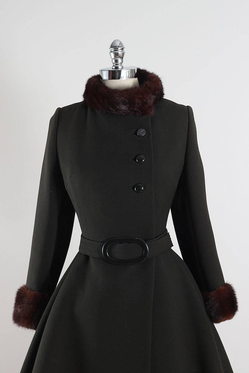 ➳ vintage 1960s coat

* green wool & brown mink fur
* satin lining
* detachable belt
* green button front
* pockets
* by Stegari NY

condition | excellent - top button has been replaced

fits like s/m

length 38