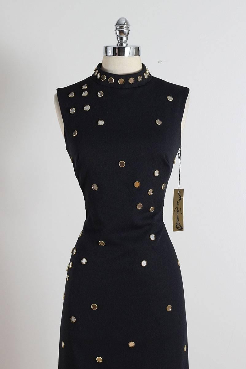 ➳ vintage 1970s dress

* black polyester
* acetate lining
* gold & clear jewel accents
* leg slit
* back zipper
* by S. Eisenberg
* new with tags

condition | excellent 

fits like large

length 57