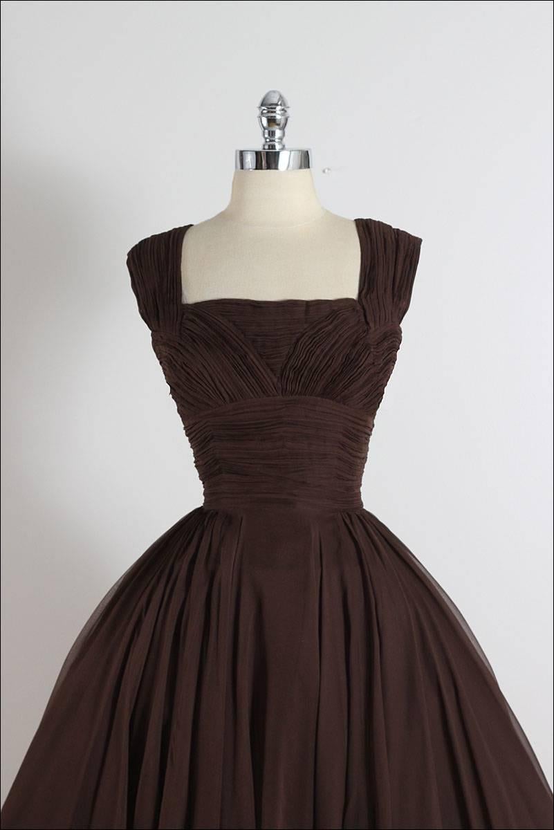➳ vintage 1950s dress

* chocolate brown silk crepe
* silk lining
* gathered bodice
* metal back zipper
* by Peggy Hunt

condition | excellent

fits like m/l

length 43.5