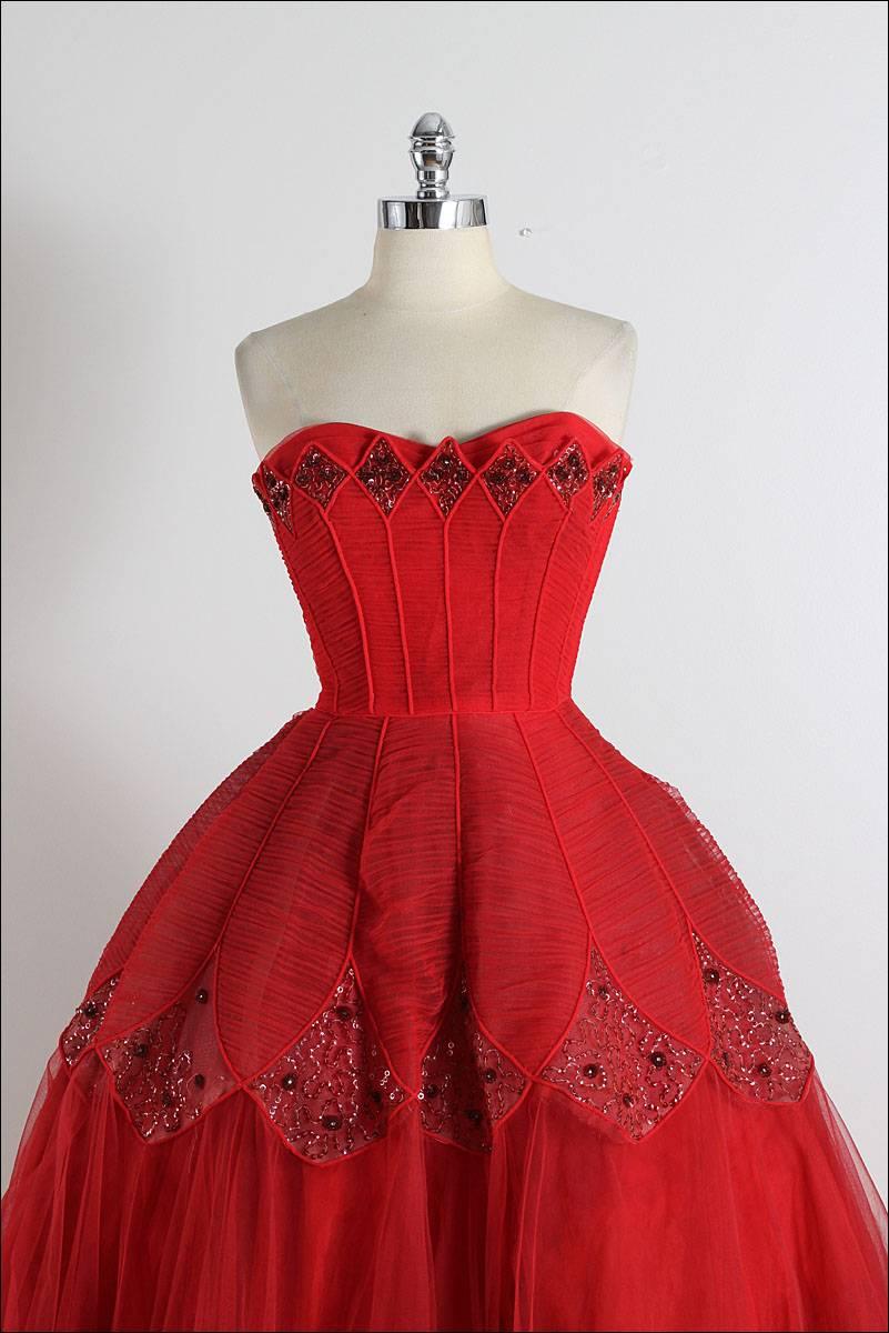 ➳ vintage 1950s dress

* red tulle
* acetate lining
* amazing diamond sequin accents
* bodice stays
* metal side zipper
* by Ceil Chapman

condition | excellent

fits like xs/s

length 49