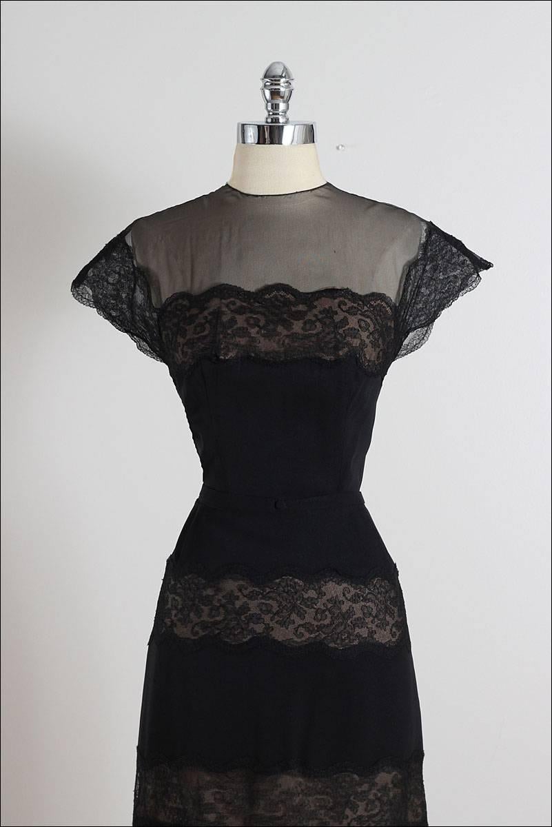 ➳ vintage 1950s dress

* black rayon crepe
* nude nylon lining
* black floral lace accents
* detachable belt
* illusion bodice
* metal back zipper
* by Peggy Hunt

condition | excellent

fits like medium

length 42