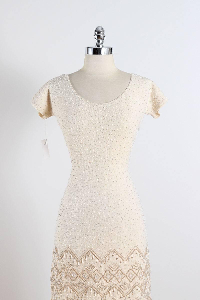 ➳ vintage 1950s dress

* Ivory knit
* amazing pearl & beaded throughout
* beaded design at hem
* metal back zipper
* deadstock with original with tags
* by L.S. Good & Company

condition | excellent

fits like m/l

length 38