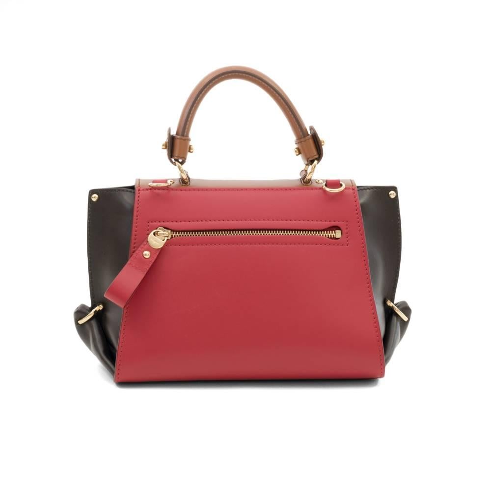 Brand new with tags. 
Salvatore Ferragamo's right-sized, structured satchel makes any look it's paired with instantly polished.

Leather. 
Top handle, detachable adjustable crossbody strap. 
Turnlock closure; lined
Exterior zip pocket, three