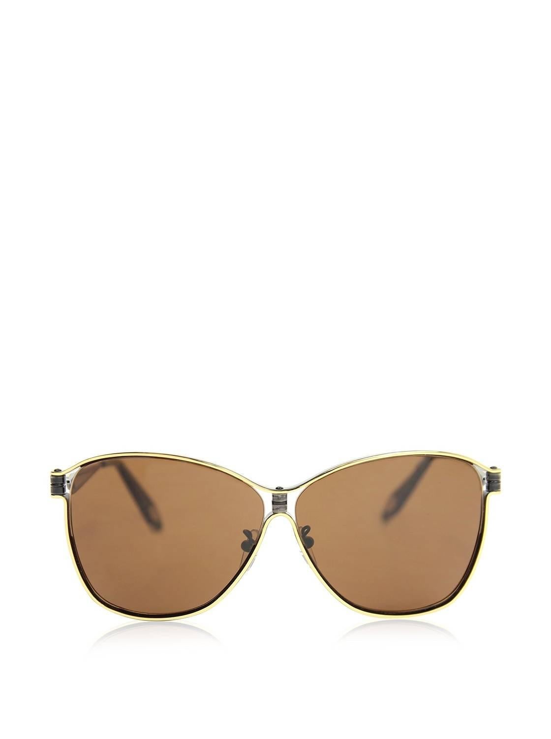 These Givenchy A52 sunglasses feature a distinct butterfly style with a raised rim design around the frame. Continuing the decades long tradition of the Givenchy Fashion House these sunglasses make a dramatic statement using exquisite materials,