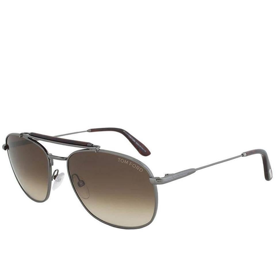 Tom Ford Marlon Aviator Sunglasses, Gunmetal (TF339)

Tom Ford TF339 09F sunglasses feature a matte gunmetal full rim double bridge modified aviator frame. The double bridge with sweat-bar completes the functional aesthetics of this pair of shades