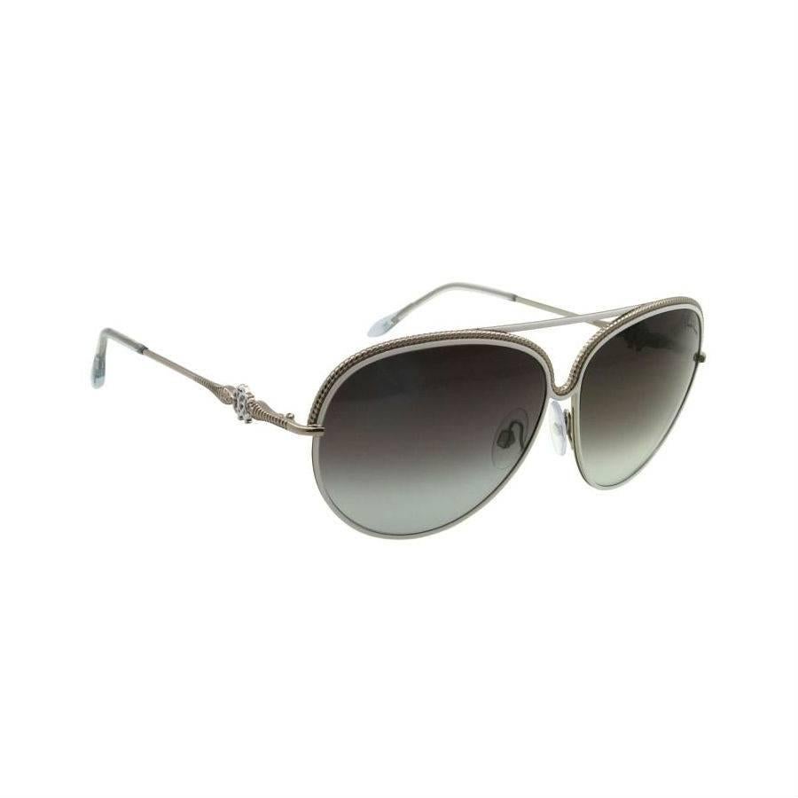 Roberto Cavalli Sunglasses, White and Silver

These Roberto Cavalli sunglasses are made from high-quality, lightweight metal with 62mm gray lenses and white frame. These sunglasses absorb 100% of harmful UV spectrums to provide premium eye