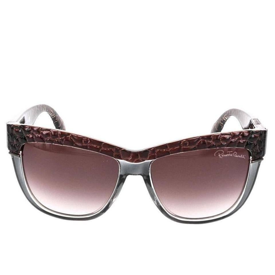 Roberto Cavalli Sunglasses, Gray Translucent and Brown

For a pair of sunglasses with an attitude to match yours, try on these Roberto Cavalli Rea shades. Brown reptile accents and grey translucent frames will be sure to go with any look, making