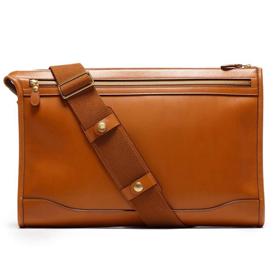 Ghurka Docket No. 7 Crossbody Bag, Chestnut Leather

To be carried as a folio or worn as a cross-body style with its removable strap, Docket No. 7 has been an elegant staple of the Ghurka business collection since 1975. Clean lines and trademark