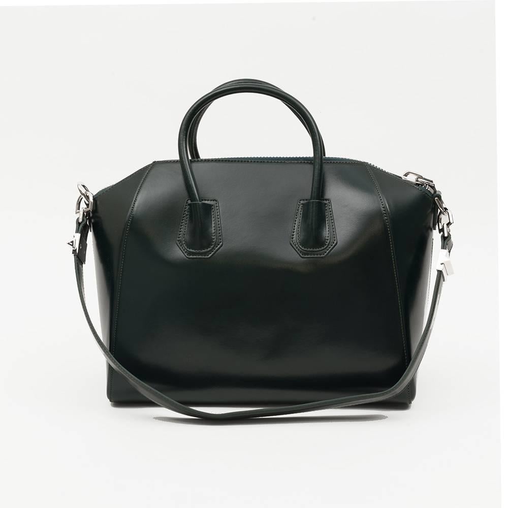 Givenchy Antigona Medium Calfskin Duffle Shoulder Bag, Green
 
 Walk around in style with this fashionable and gorgeous duffle from Givenchy. Immaculately crafted in Italy, the calfskin leather exudes class and sophistication while a smartly