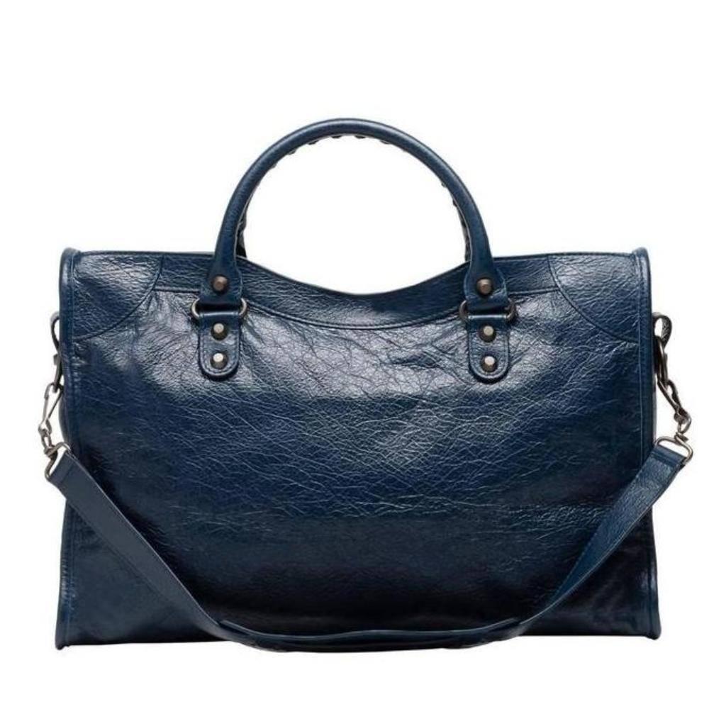 Balenciaga Classic City Handbag Satchel, Bleu Obscure

Designed exclusively for the runway, this iconic bag, also known as the Motorcycle Bag, offers signature "Classic" or "Giant" studs and a unique leather-framed mirror.