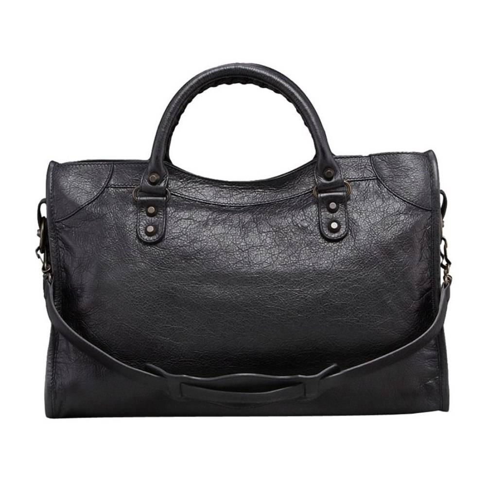 Balenciaga Classic City Handbag Satchel, Black

Designed exclusively for the runway, this iconic bag, also known as the Motorcycle Bag, offers signature "Classic" or "Giant" studs and a unique leather-framed mirror. Designed to