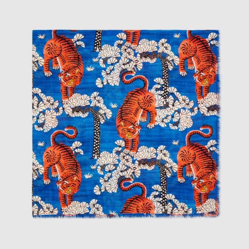 Gucci Bengal Tiger Print Modal Silk Shawl, Multicolor

The Gucci Bengal print, introduced for Cruise 2017, depicts tigers scattered amongst a colorful forest represented through brushstroke-style graphics to create a three-dimensional