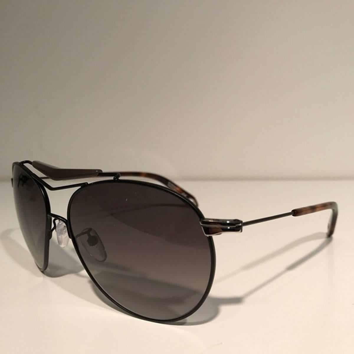 Givenchy Black Aviator Sunglasses
Color: Black/Gray
Size: OS

Brand new with box.
Unused condition.
No flaws.
Made in Italy.