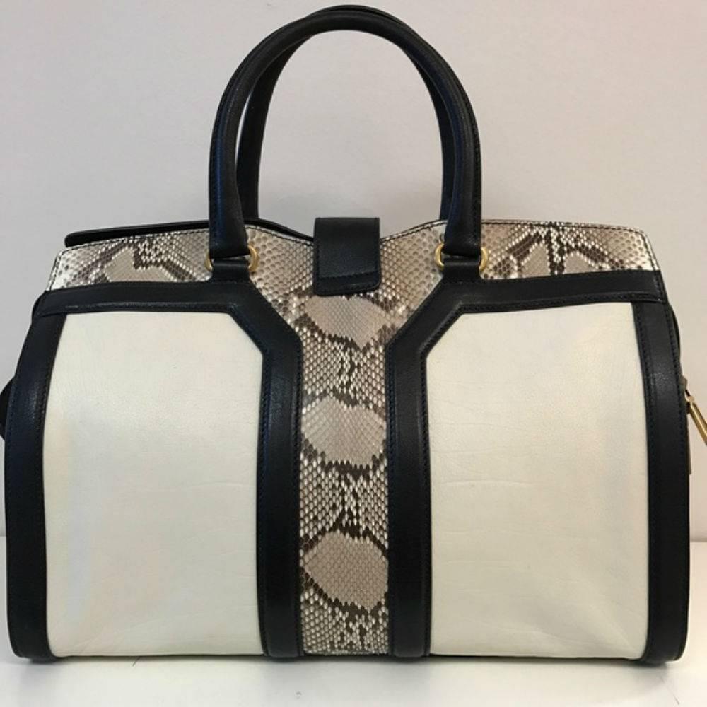 Saint Laurent Large Cabas Satchel White Python
* Brand new unused condition with all cards and dustbag. 
* Calf leather and python with YSL engraved on the hardware. 
* Antique gold hardware. Made in Italy.
* Color: Black and White