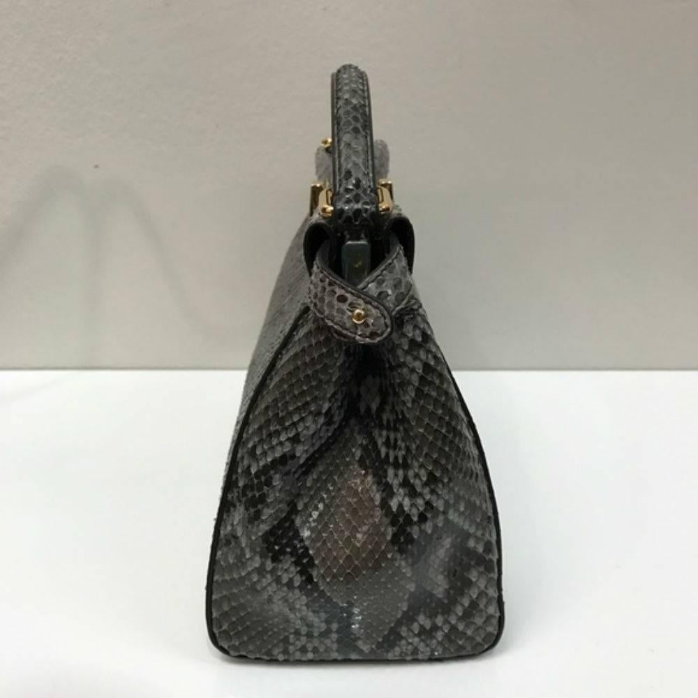 Fendi Mini Python Peekaboo Crossbody Bag

Brand new in unused condition without any flaws. Strap, raincoat, cards and dustbag included. 
Made in Italy.
