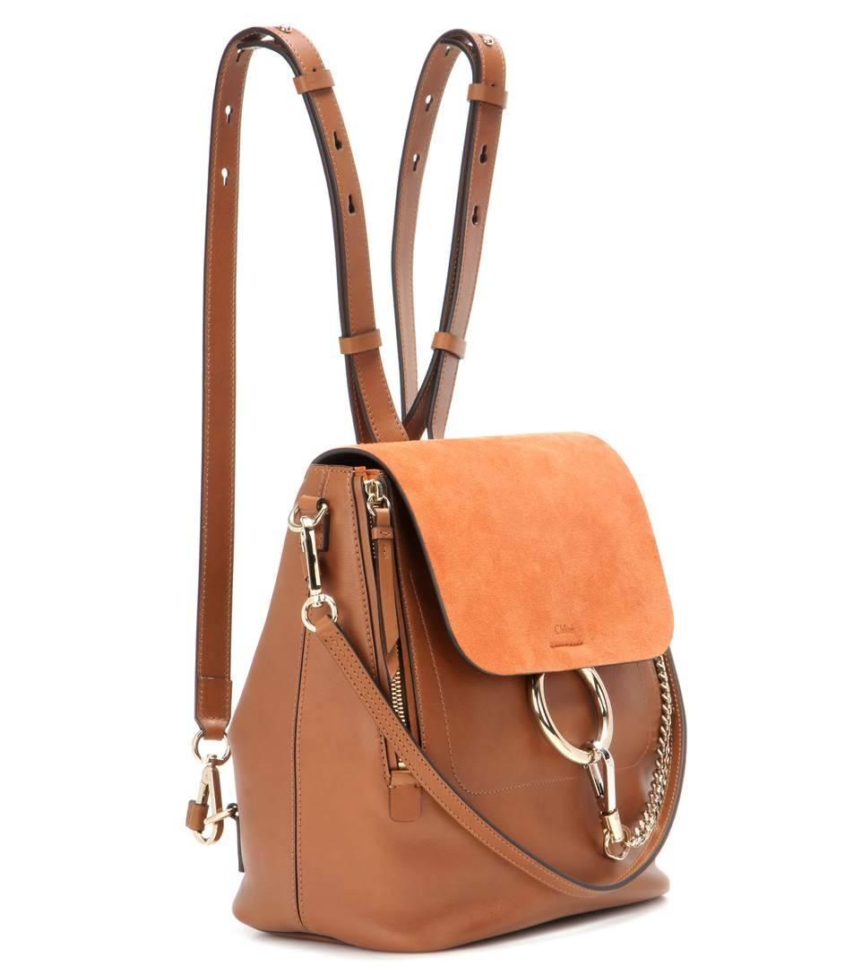 Chloé takes its iconic Faye style and douses it in back-to-school fun this season. Expertly crafted 

in Italy, this elevated backpack comes with a smooth tan leather body, a supple suede flap in burnt 

orange and luxe hardware for statement shine.