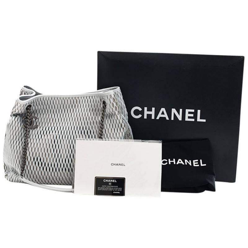 Brand new. A beautiful Silver x Black mesh bag made from Lambskin by Chanel.

- Silver-Black Hardware
- Intertwined chain long strap
- Signature logo at the front
- Interior zip pocket

Made in Italy
With tags, card, dustbag and box