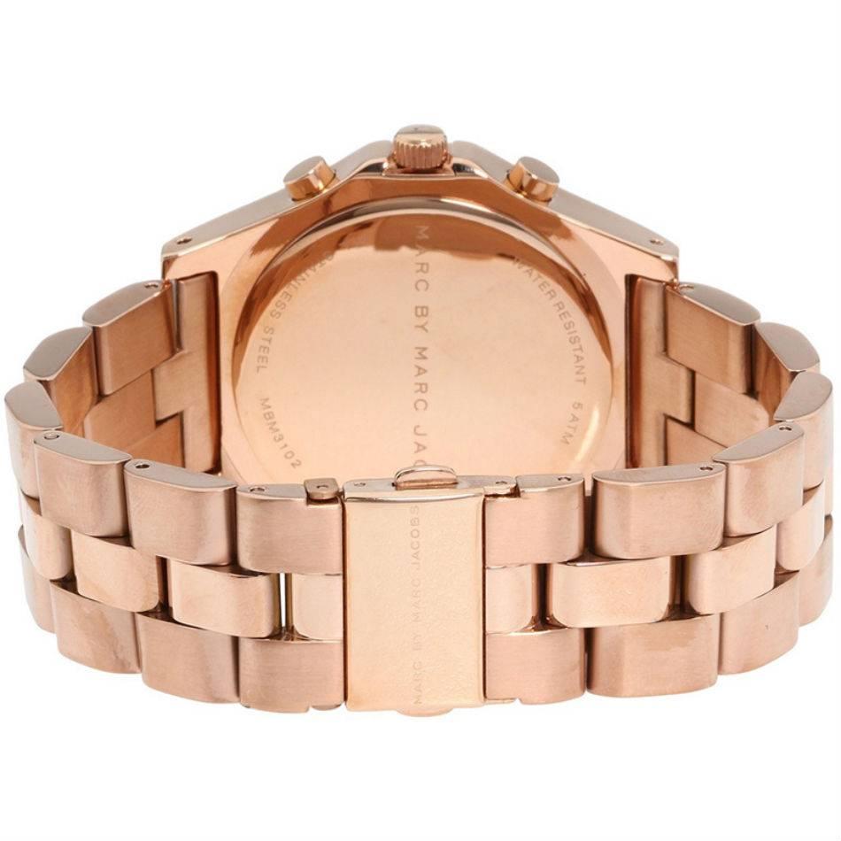 Feminize your everyday style with this lovely Blade watch by Marc by Marc Jacobs. Rose-gold ion-plated stainless steel bracelet and round case. Bezel etched with logo. Rose-gold-tone chronograph dial features crystal accent markers, three subdials,