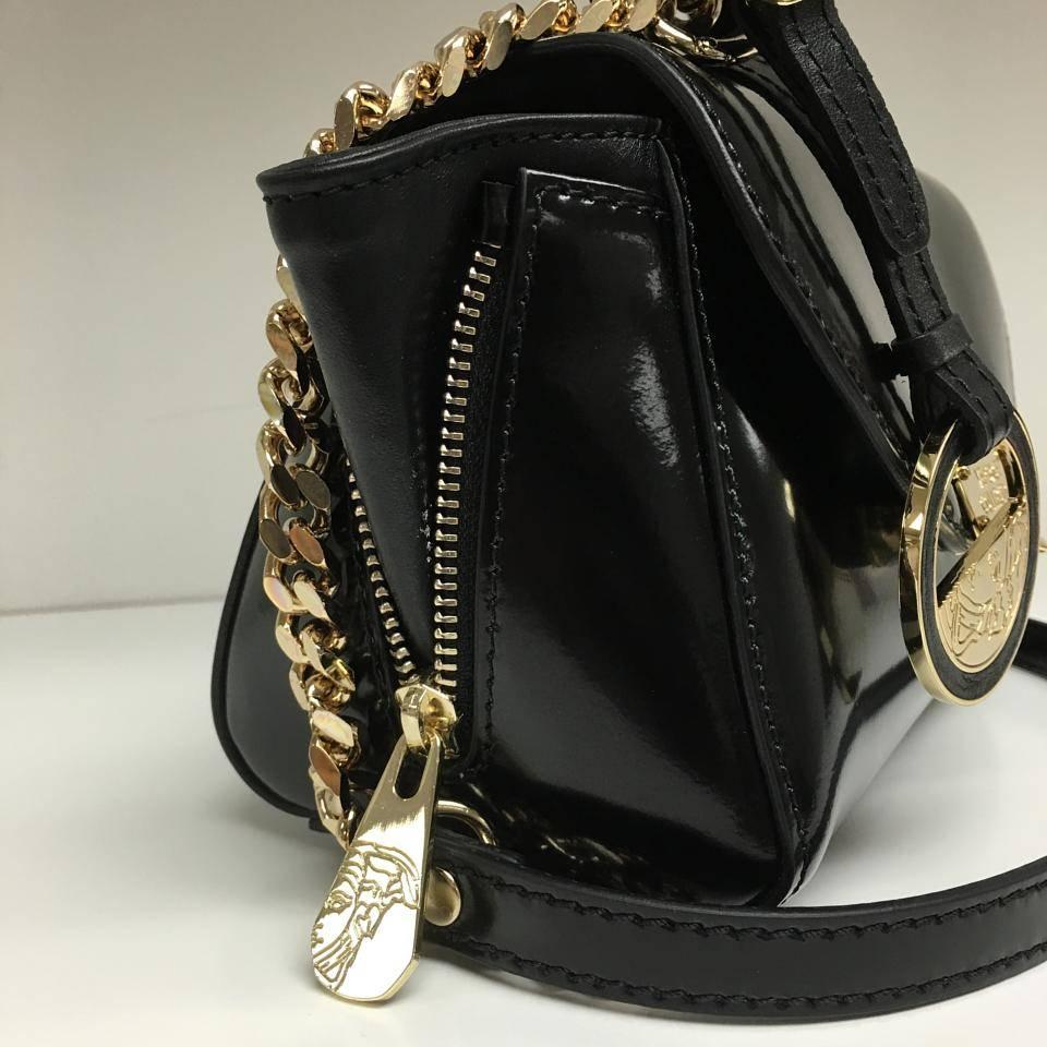 This item has original tags and shows no visible signs of wear.

DESCRIPTION
Versace Collection Patent Leather Mini Satchel Bag, Black

Stylish and timeless, this Versace Collection mini bag is a must.

Features:
o Made from black patent