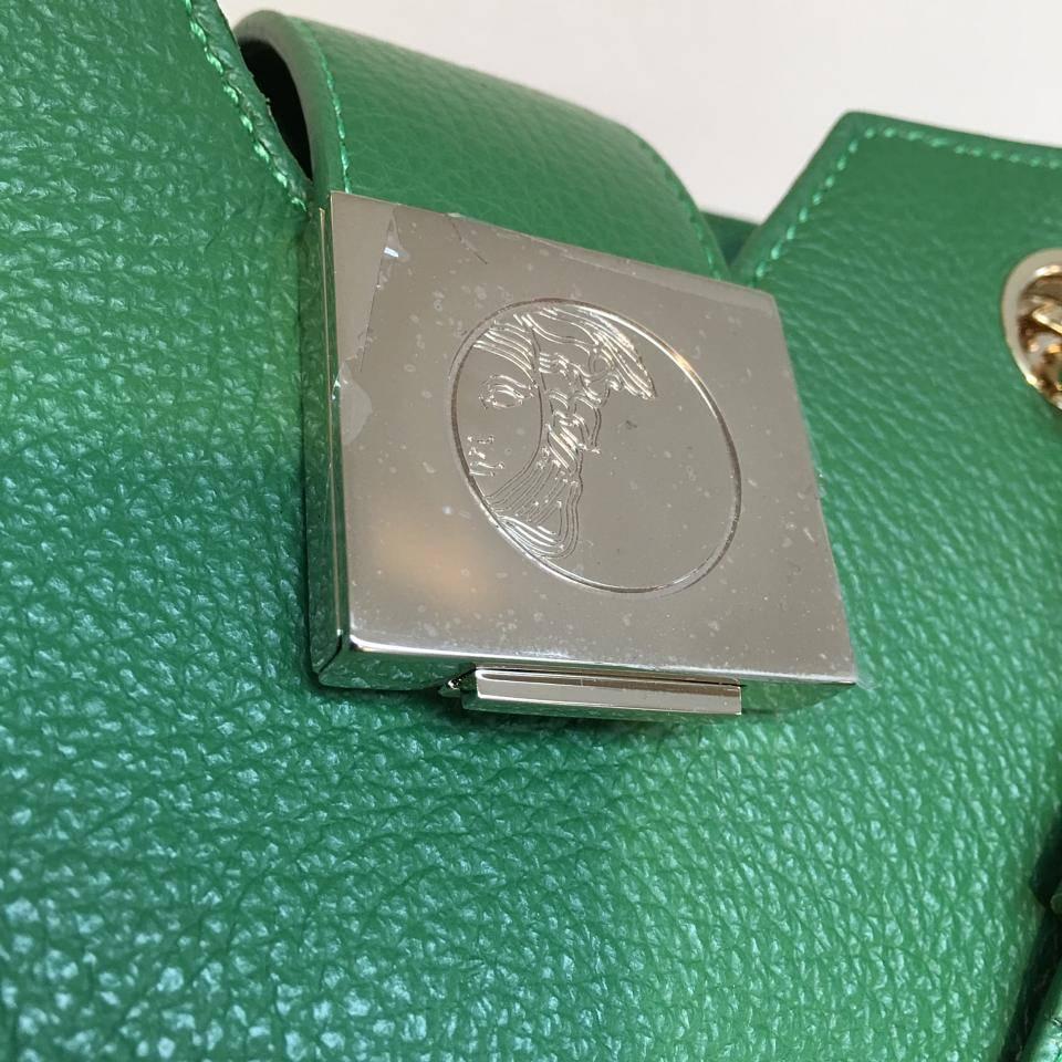 Versace Collection Pebbled Leather Tote, Green

Sleek, stylish Versace bag for any formal and casual occasion

Features:
o Versace signature design and superior quality
o Made from 100% Leather in grainy finish
o Studded with gold tone