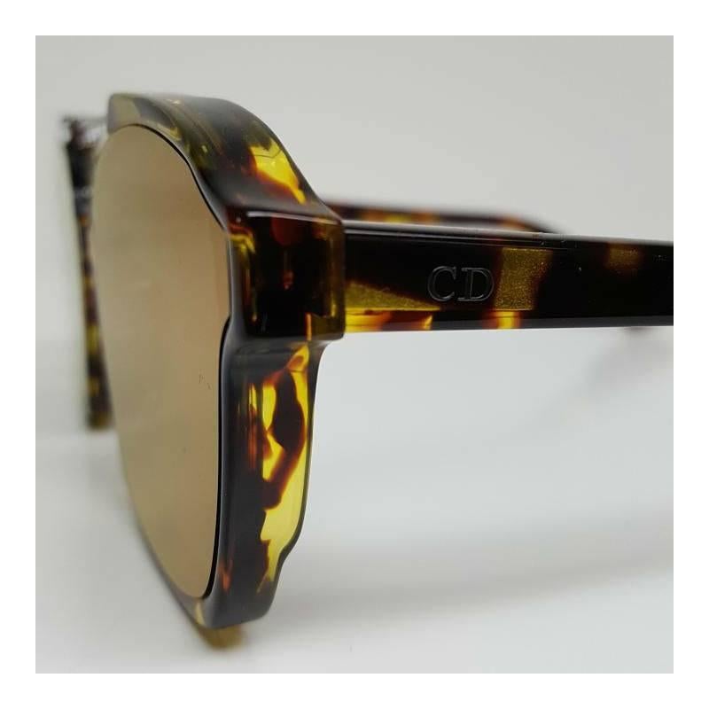DIOR Abstract Sunglasses

Brand new, never used and comes with Dior box. 
There are no marks or scratches, new condition.

Frame size: 58-17-145mm (Eye-Bridge-Temple)

Comes with a distinctive browline that adds to the street-savvy look of
