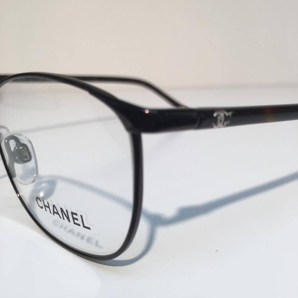 Chanel Eyeglasses, Dark Havana (CH2165T)
 
Brand new, never used & in excellent condition
 
Chanel glasses are always on the cutting edge of fashion and style. Known for their distinctive and innovative designs and with all frames made