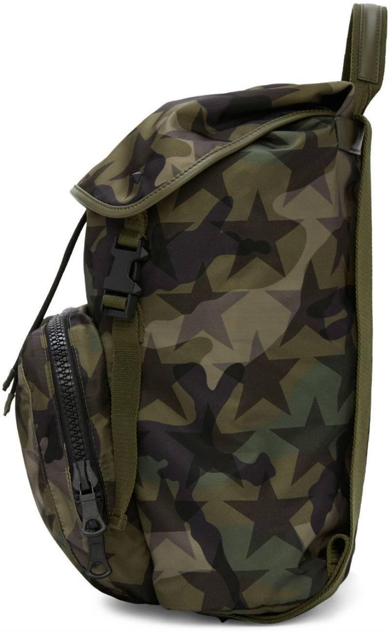 Valentino Camustars Backpack, Green Nylon

Material: Nylon
Tonal buffed leather and grosgrain trim throughout.
Carry handle.
Adjustable shoulder straps.
Signature pyramid stud in black and zippered compartment at face.
Leather logo patch at