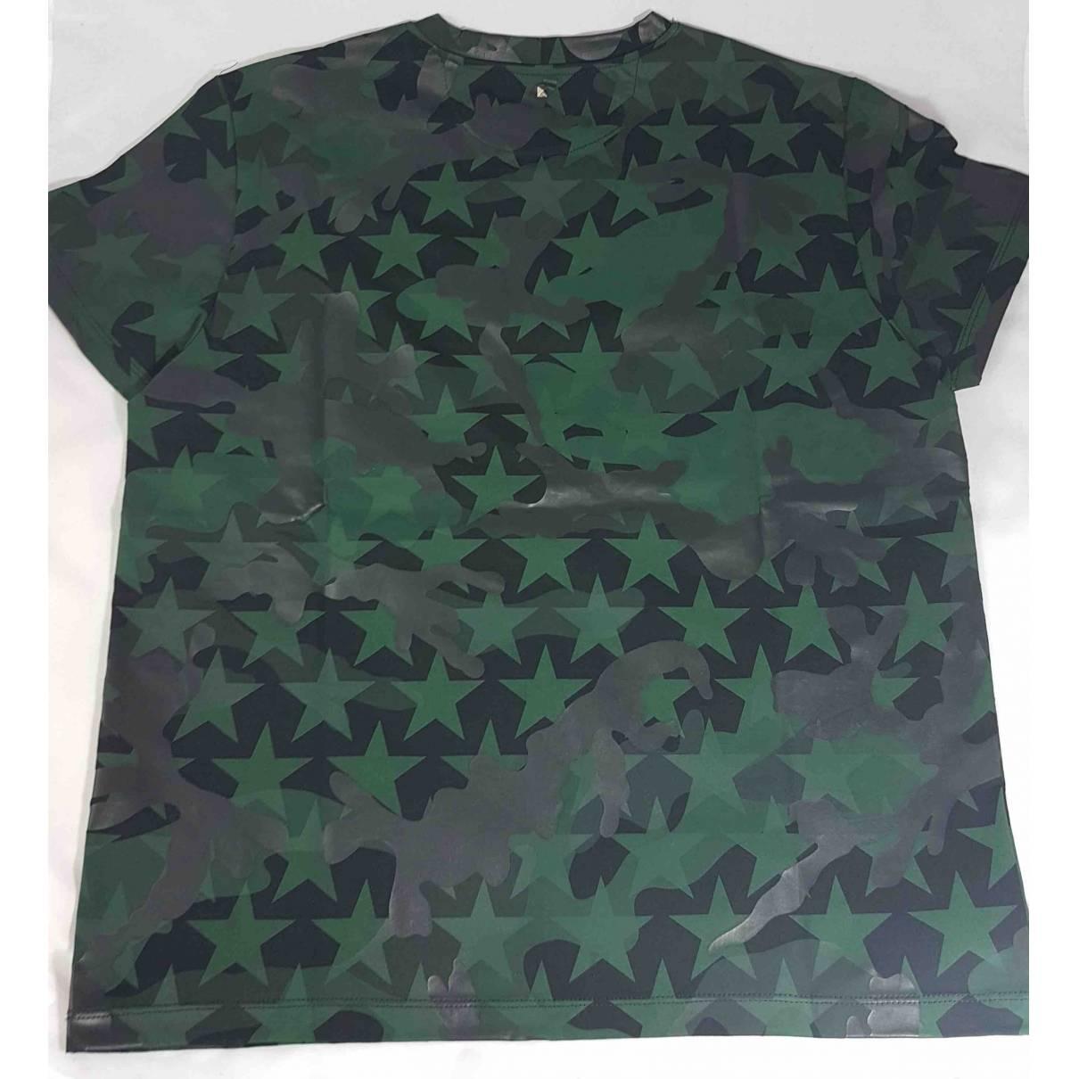 Valentino T-Shirt in black Camustars. Still New. 
New technique printed cotton Iconic stud at back of neck. 
M size. 
Made in Italy.