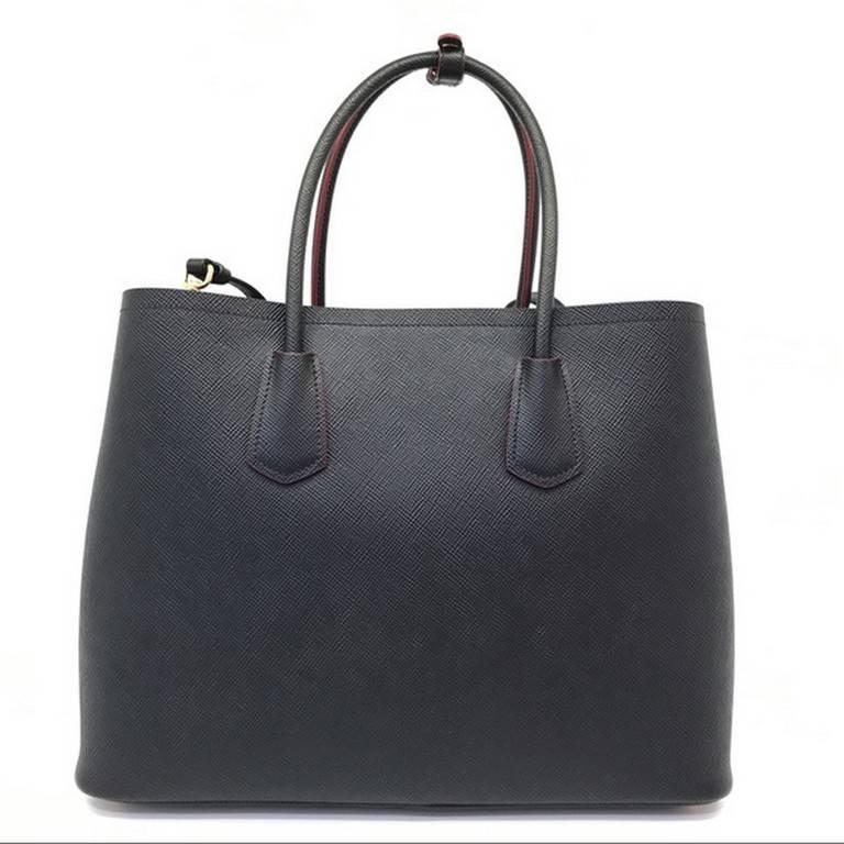 Prada Saffiano Cuir Leather Double Bag Tote Black :- 
Brand new with cards and dustbag. Saffiano Cuir leather. Style: B2756T. Shoulder strap included. Made in Italy.
