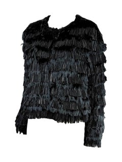 Roberto Cavalli, colección Prefall 2013: chaqueta negra de piel de cordero y llama con flecos
