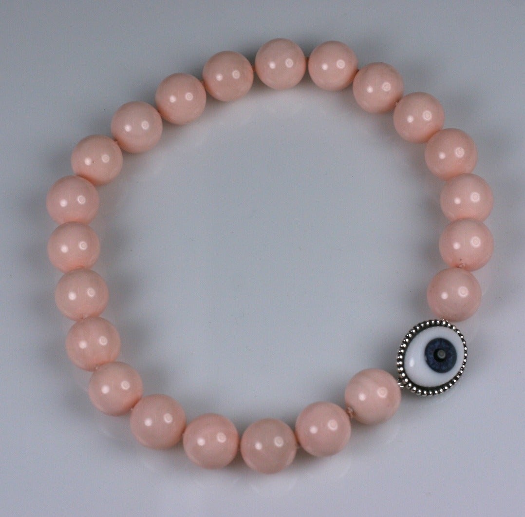 Classic bead necklace with large 18mm hand knotted mother of pearl beads with pale coral lacquer. Signature MWLC 