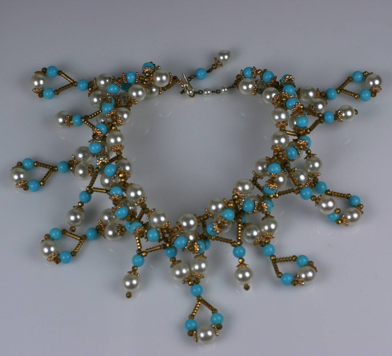 Oversized Italian choker necklace of faux resin pearls and turquoise and gilt resin tube beads. Massive proportions without the weight. Italy 1960's.
Length 14