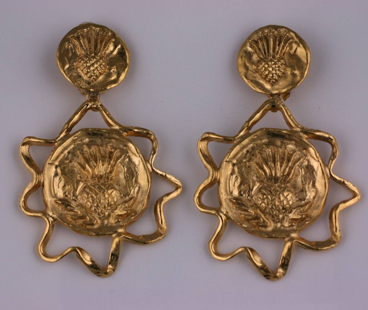 Yves Saint Laurent long gilt byzantine, thistle  motif incised earclips by Robert Goossens. Length 3